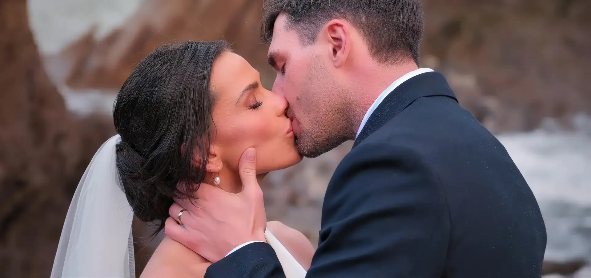 Bride and groom at Tunnels Beaches Ilfracombe - captured by Dandoo Videography